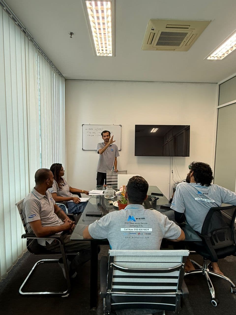 MyAccool team planning on a whiteboard